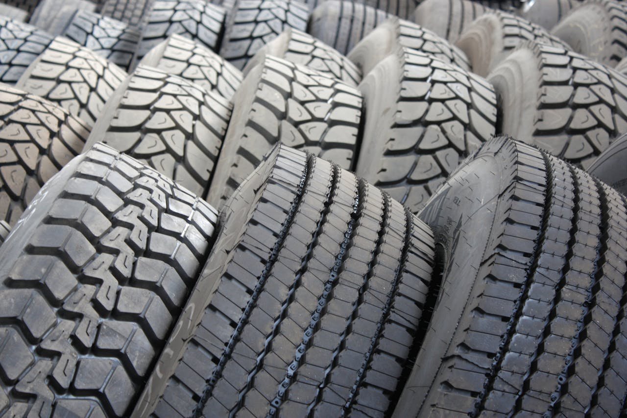 High-quality image of stacked industrial tires showcasing tread patterns.